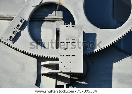Partially view of a great gear wheel of a military construction.