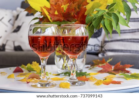 Autumn fall leaves and two wine glasses .Still life concept.