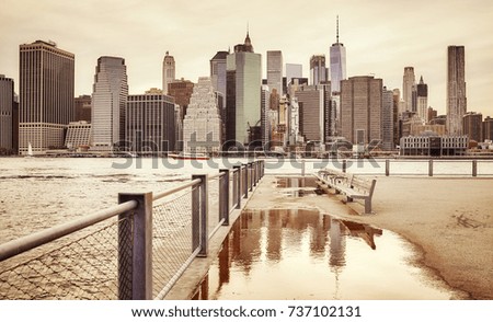 Retro toned Manhattan skyline seen from Brooklyn, New York City, USA.