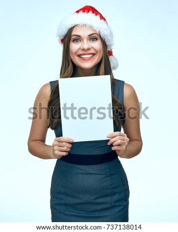 Smiling Santa girl business woman holding white blank advertising banner. isolated portrait.