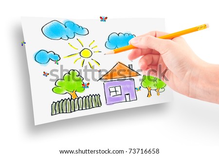 Woman's hand with the pencil and brushes drawing the dream home on a white sheet of paper