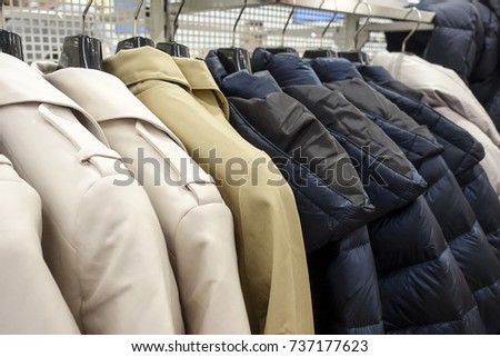 Clothing store. Jackets hang on hangers.