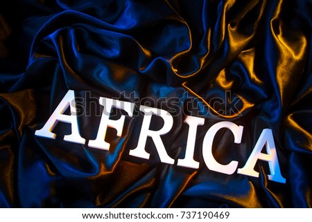 Word Africa from voluminous letters. Word Africa on a black background.