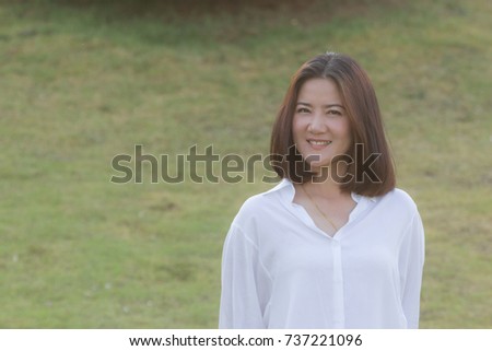 Portrait of Beautiful Woman Beauty Face Stand in The Park, Close Up. Asian Caucasian Female Model Portrait Close Up Concept. Copy Space for Text.
