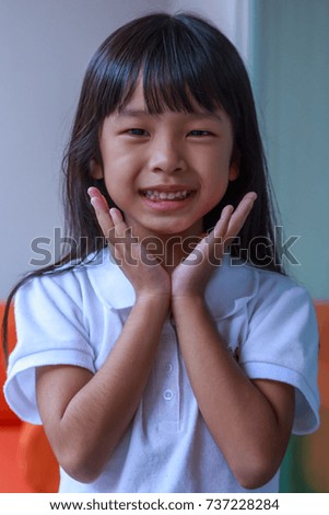 Portrait of happy Asian little girl.
