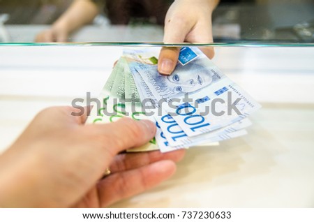 Sweden krona (SEK), Sweden money, Women giving money currency of Sweden. Exchange money for Sweden krona (SEK), business and finance concept.
 Royalty-Free Stock Photo #737230633