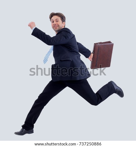 Isolated attractive business man running away from someone