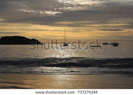 Amazing sunset with a sailing boat in Costa Rica