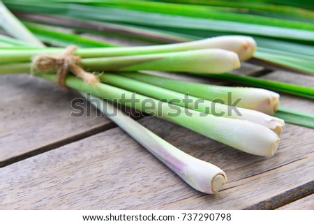 Fresh lemongrass  on wooden texture in cooking concept. Royalty-Free Stock Photo #737290798