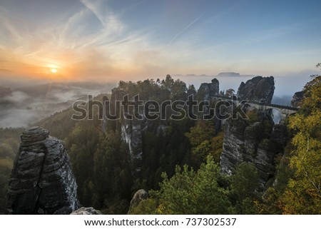 beautiful, foggy sunrise in the Saxon Saxony park, view from the Bastei lookout point