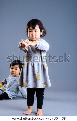Cute twins children studio portrait