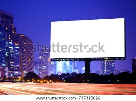 Advertising concept, Blank template  for outdoor advertising or Blank billboard with a background of city. With clipping path on screen - can be used for trade shows or promotional poster.