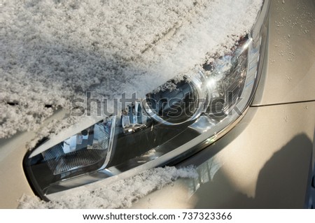 Winter landscape. snow covered car. Sunny day, heavy frost.