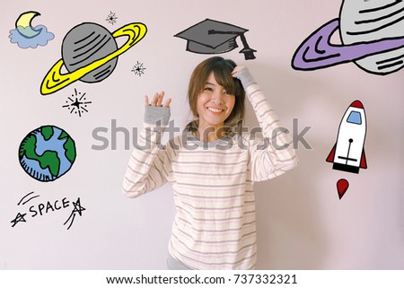 Young Asian woman  wearing graduation hat doodles with stars and space  illustrator doodles - space and science concept

