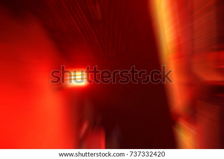 blurred low key Illuminated factory industry red alert emergency light with copy space  for background