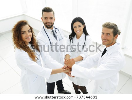 friendly team of doctors shows their success