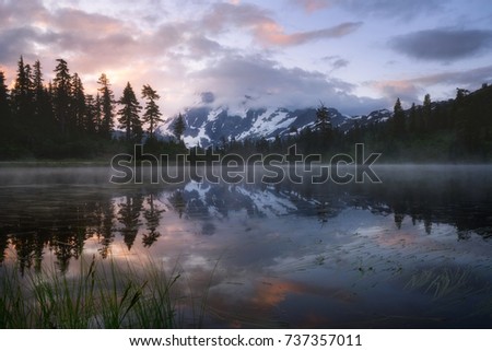 Sunrise reflection of Mount Shuksan at Picture lake, Mount Baker National Forest, Washington.