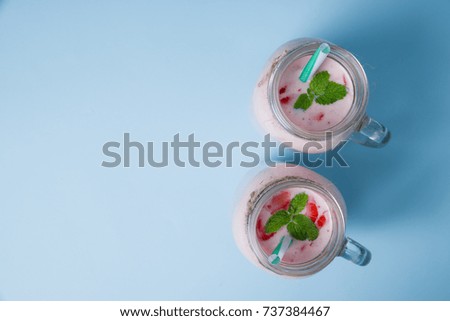Yogurt view from above on a white-blue table background