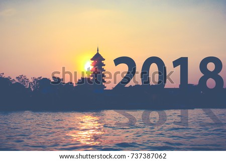 Happy new year 2018 text calendar with sunrise background cover concept template number pass from 2017 go to 2018