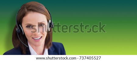 Close-up of smiling woman talking on microphone headset against green abstract background