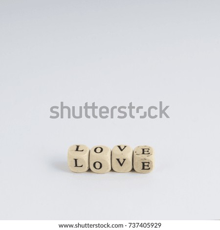 formation of the word Love with nuts containing the letters