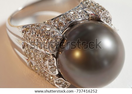 High Value Gems Stone accessories, Big Black Deep Sea Pearl on Diamond around holder Ring,  Studio lighting white background, HDR stacking macro photo