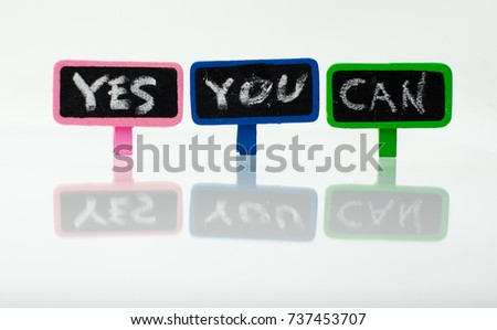  Colorful wooden clip with text Yes You Can on white background.