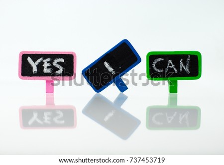 Colorful wooden clip with text Yes I Can on white background.
