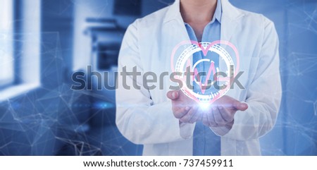 Midsection of female doctor standing with hands cupped against vacant corridor Royalty-Free Stock Photo #737459911