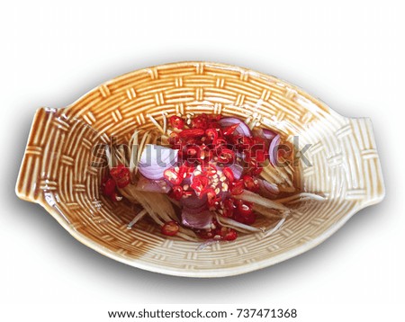 Isolated picture with a Chili Sauce in Tiled Plate