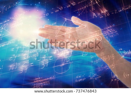 Cropped image of hand pretending to hold invisible object against image of geometric equations solved on blackboard