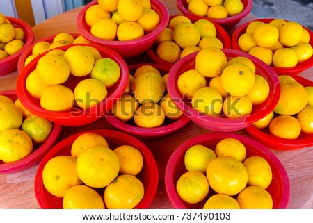 Tangerines in stack in a street market Royalty-Free Stock Photo #737490103