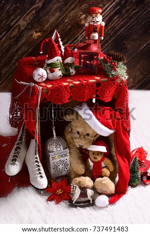 christmas teddy bears in santa claus outfits with old toys in rustic style interior with wooden wall