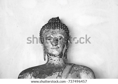 Ancient Buddha statue in Temple of Thailand. This image was blurred or selective focus. Black and white picture.