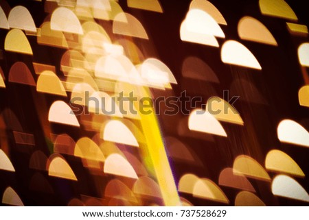 Abstract xmas Golden sparkles or glitter lights. Christmas festive gold background. Defocused bokeh  particles. Template for design