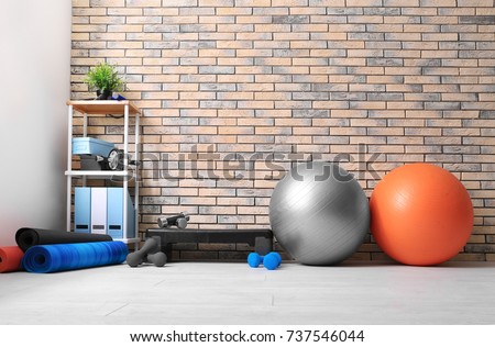 Different physiotherapy equipment in room Royalty-Free Stock Photo #737546044