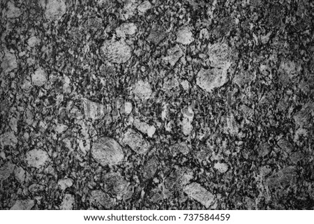 Black stone , black granite cracked  texture surface seamless pattern in black and white with vignette effect for background or wallpaper