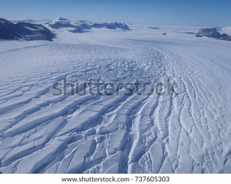 Glacial ice fractures in Antarctica. Royalty-Free Stock Photo #737605303