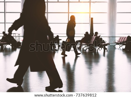 The passengers in the airport, the business background.