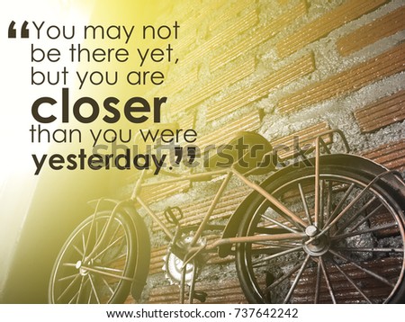 Inspiration quote on blurred background.