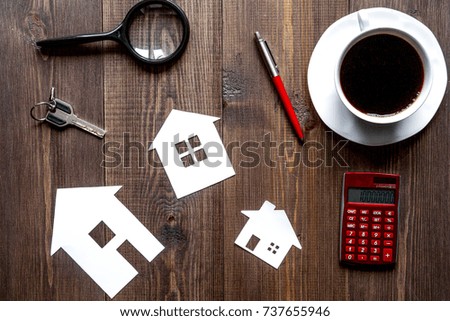 concept of buying house on wooden background top view