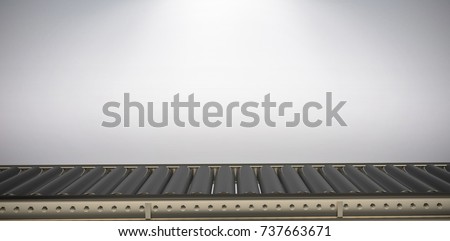 Digital image of empty conveyor belt against grey background Royalty-Free Stock Photo #737663671