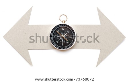 Cardboard navigation arrows with compass on a white background