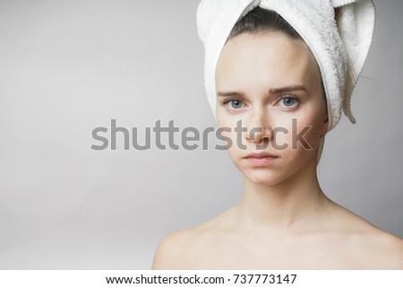 Beautiful woman with towel on the head looking to camera,smile