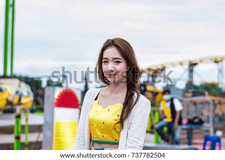 Beautiful women are happy in the amusement park.