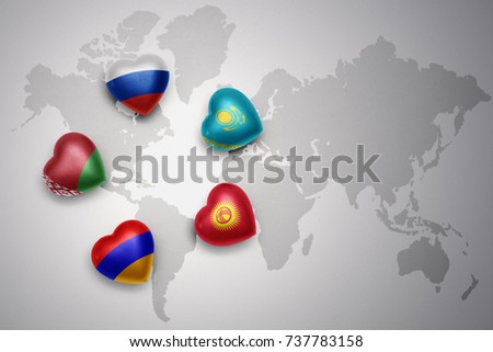 hearts with flags of the five countries of the eurasian economic union, russia, belarus,armenia,kazakhstan, kyrgyzstan on a world map background. concept Royalty-Free Stock Photo #737783158