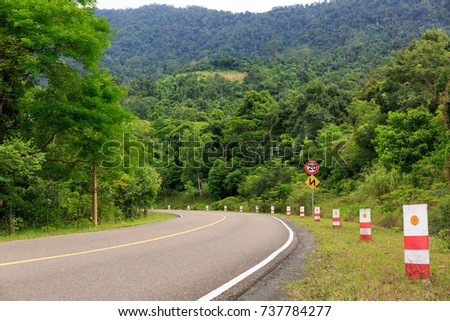 Road Signs Show Maximum Speed 20 KM/H and Double Bends.