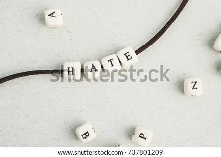 Letters beads word Hate. Horizontal composition. a series of minimalism phrases and words.