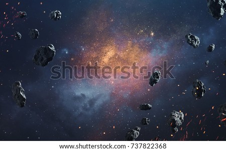 Abstract cosmic background with asteroids and glowing stars. Deep space image, science fiction fantasy in high resolution ideal for wallpaper and print. Elements of this image furnished by NASA