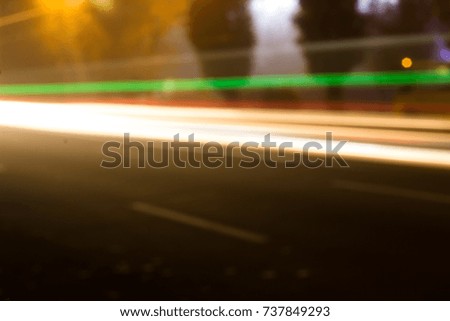 Blurred Defocused Lights of Heavy Traffic on a Wet Rainy.